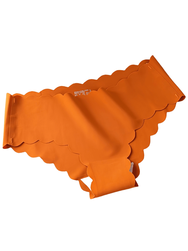 Vibrant orange seamless low waist briefs with scalloped edges, offering a feminine touch and comfort.
